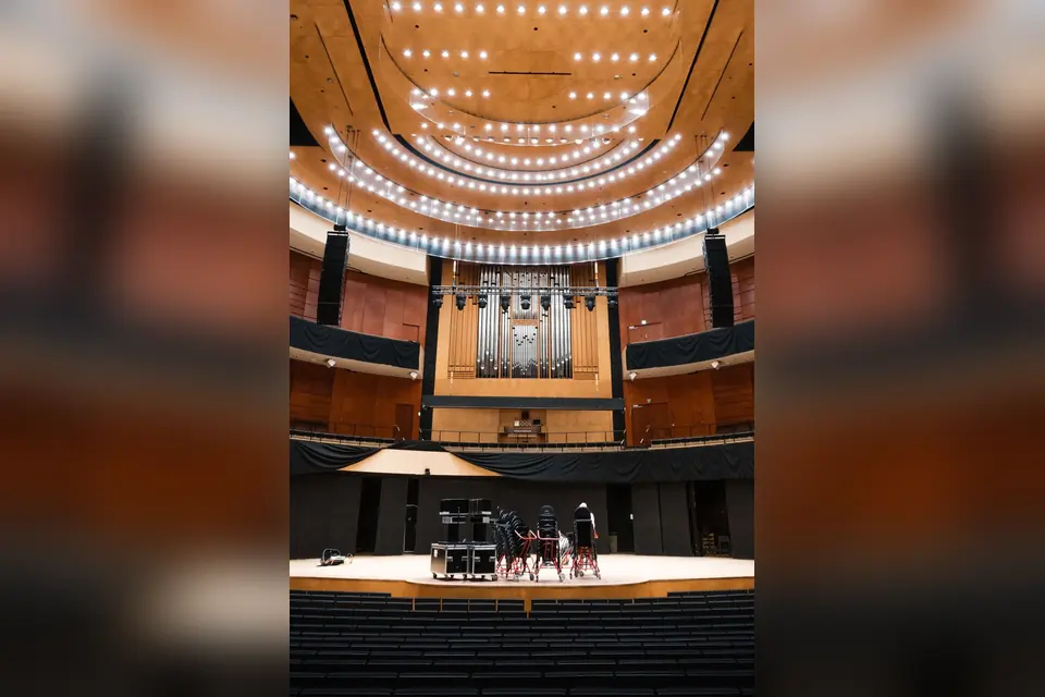 The inside of a large auditorium with a large stage