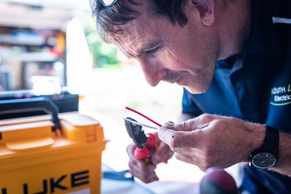Electronics Technician Working with Wiring Tools