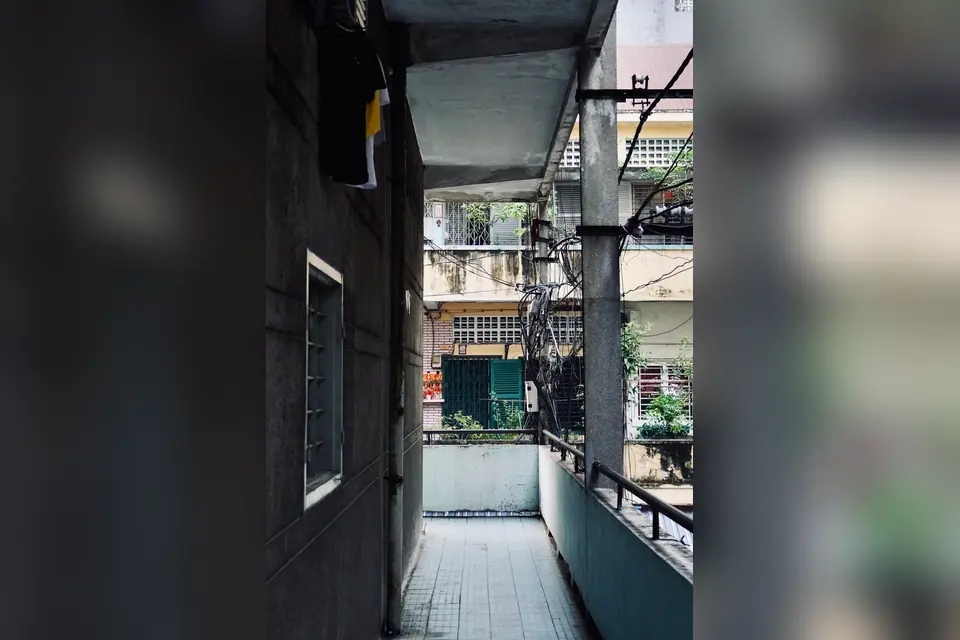 Urban Apartment Corridor with Overhead Wiring