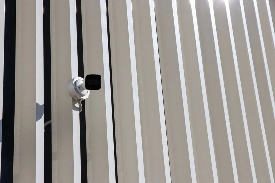 Minimalist Security Camera on Modern Building
