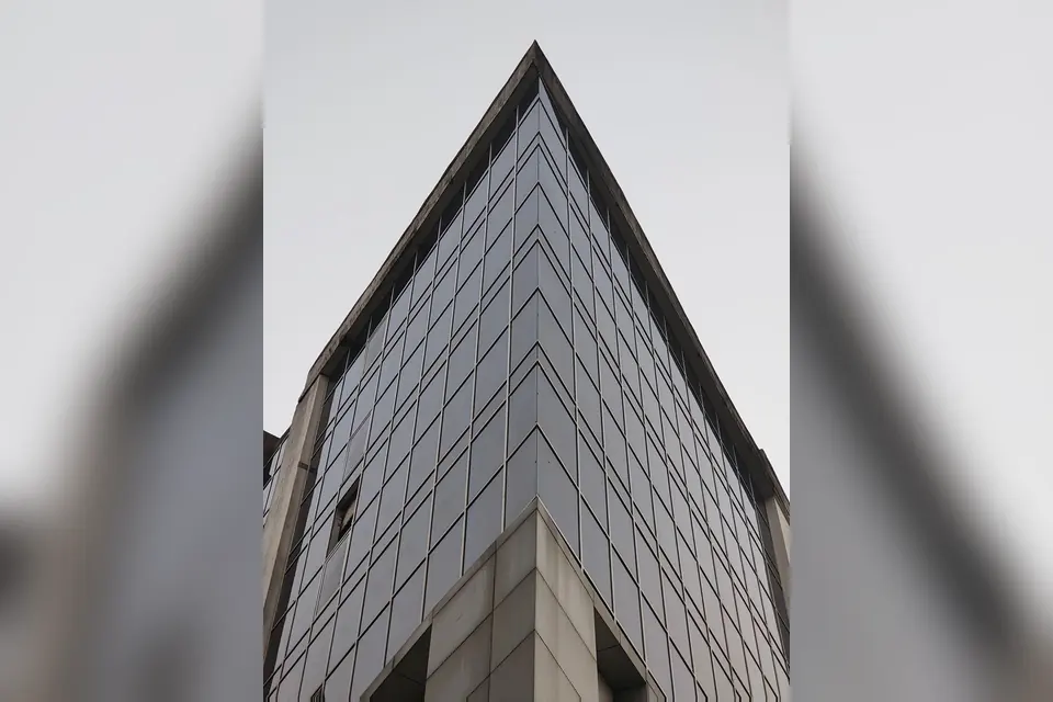 Modern Glass Office Building in Urban Setting
