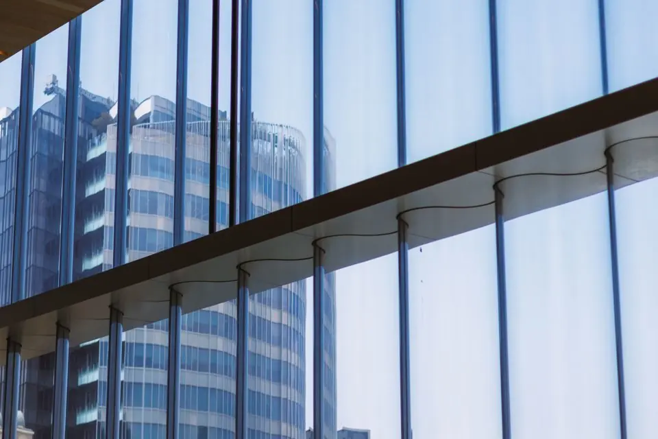 Modern Office Building Reflection Through Glass